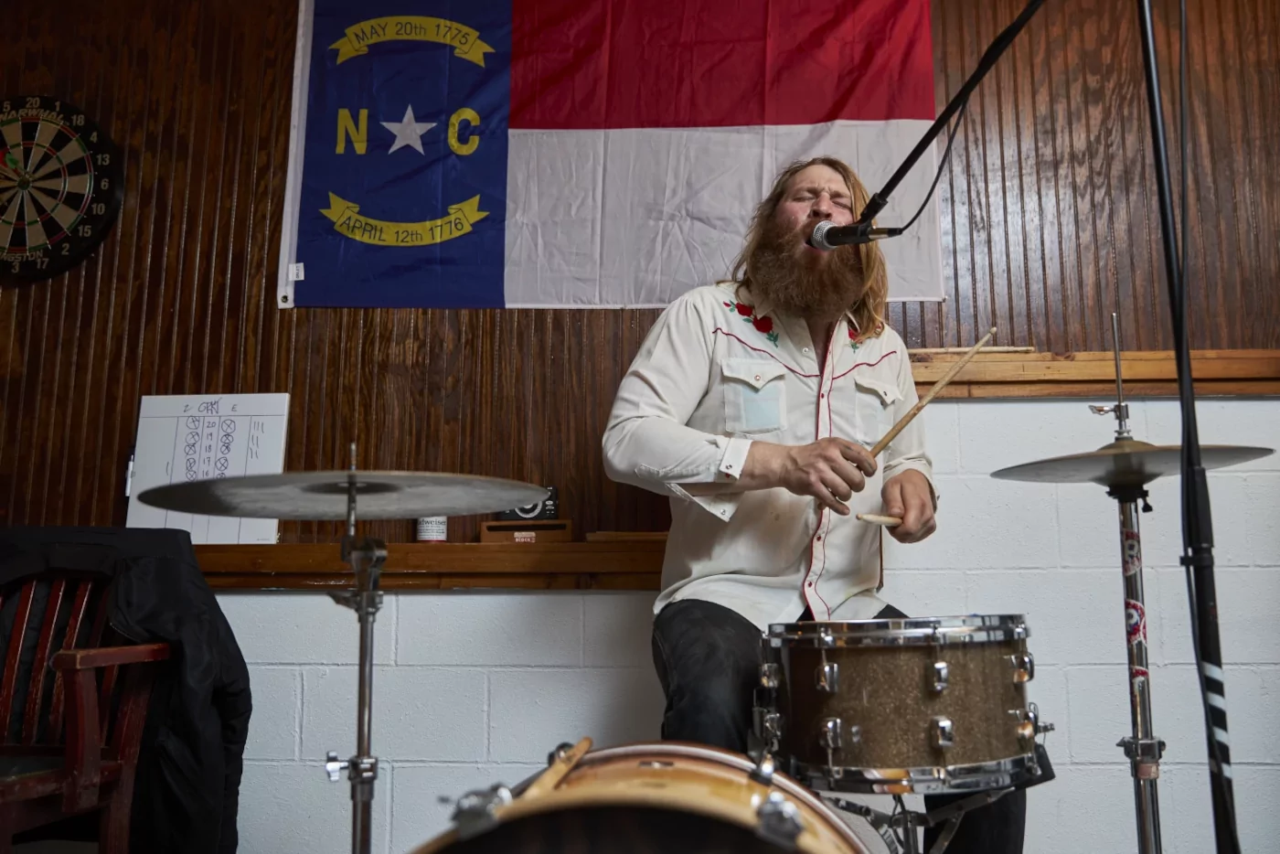 Ernie playing drums and singing