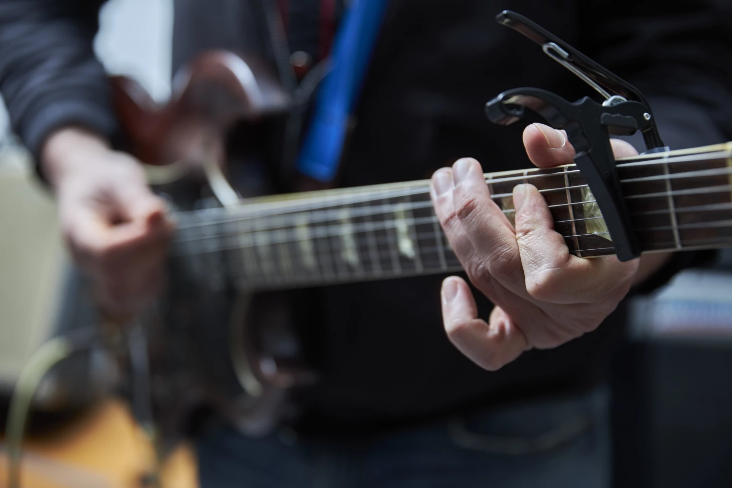 Guitar being fretted