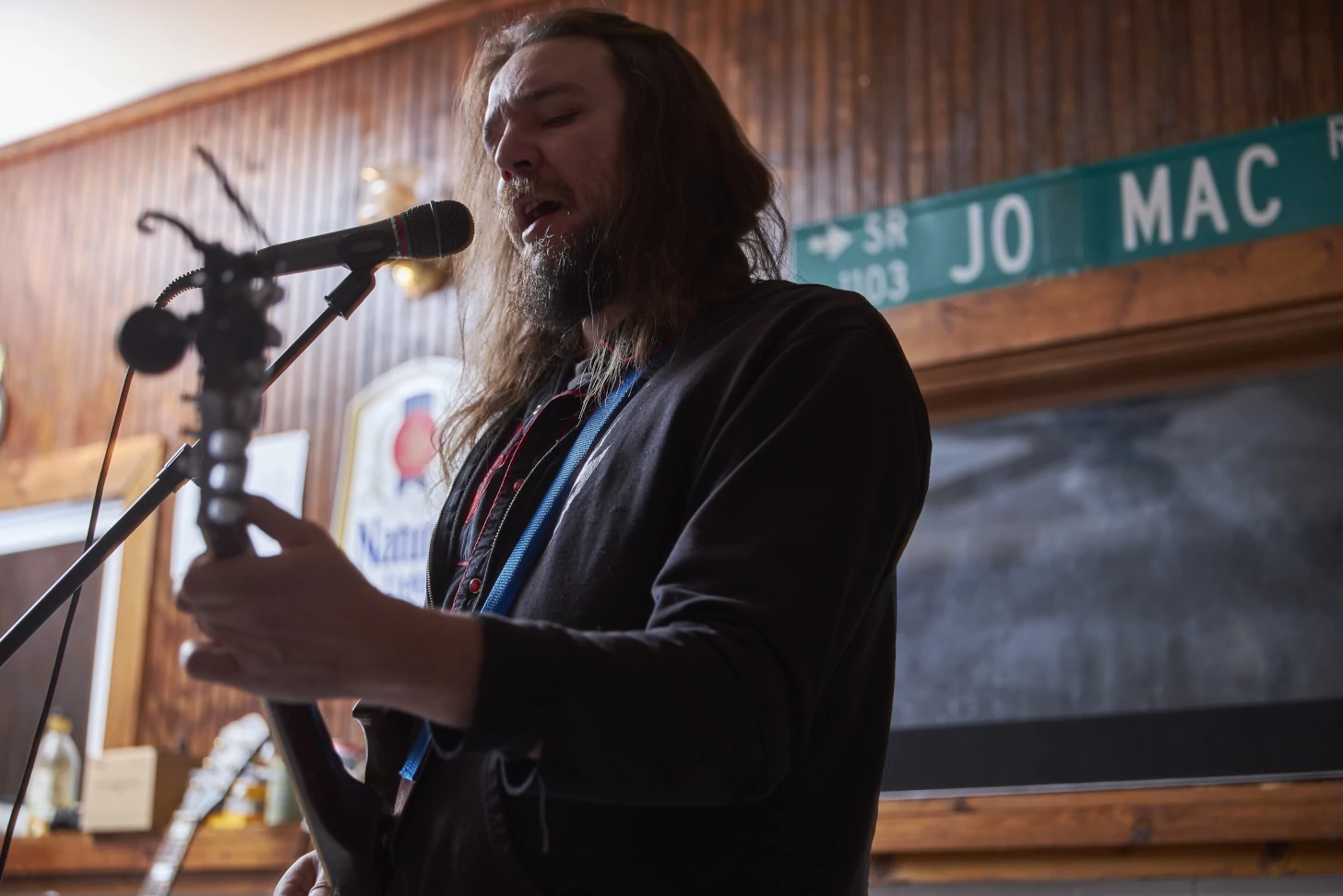 Zach singing and playing guitar